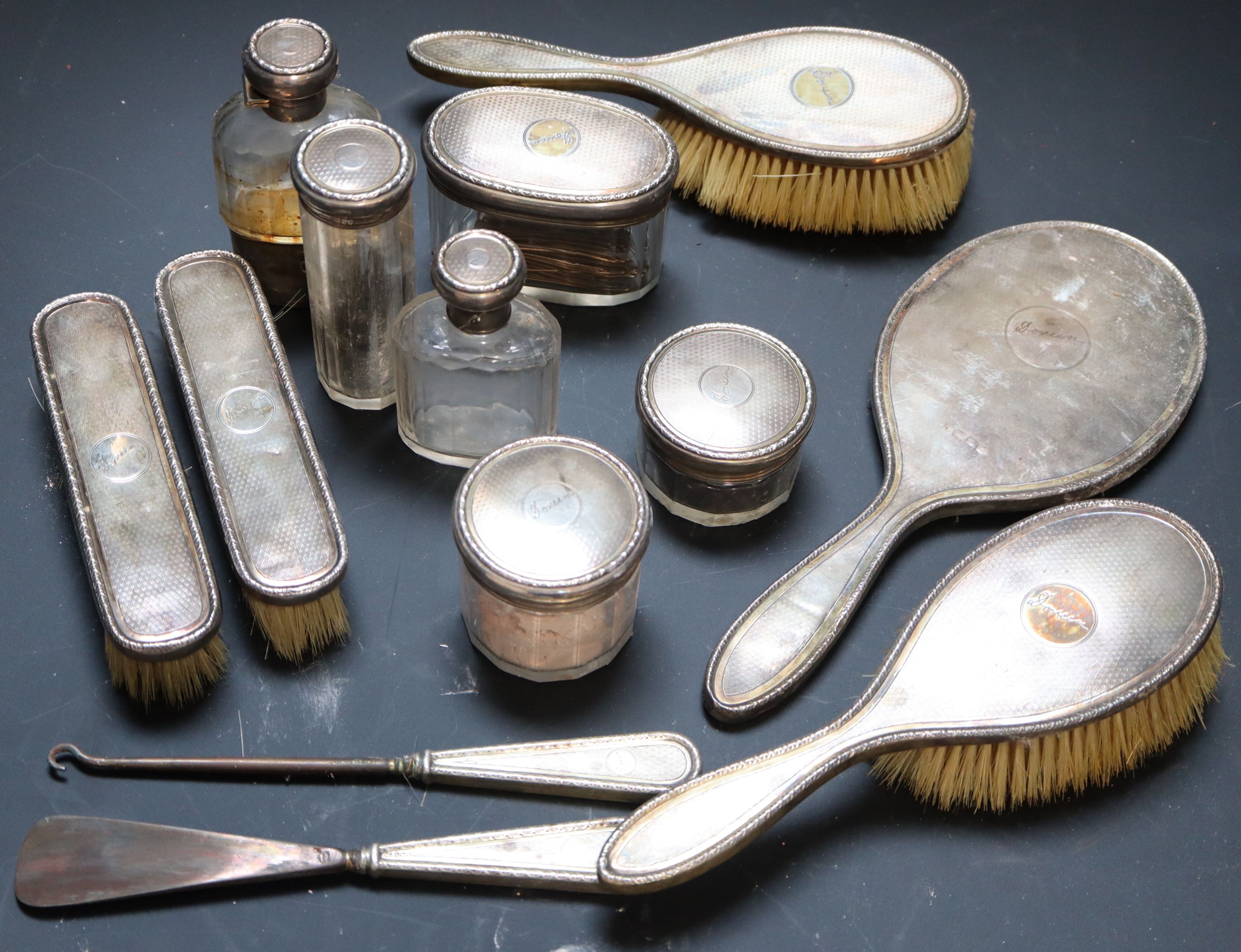 A matched 15 piece silver mounted toilet set etc.